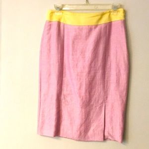 Straight skirt with 2 accent front splits. Lined.